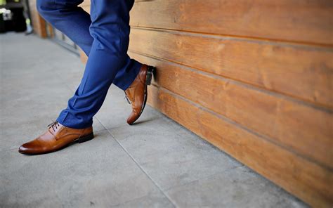 blue pants brown shoes.